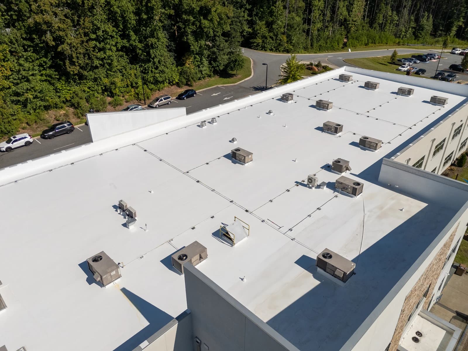 Mountain Island Charter School roof coating, aerial view 5 of completed multi-layer silicone system
