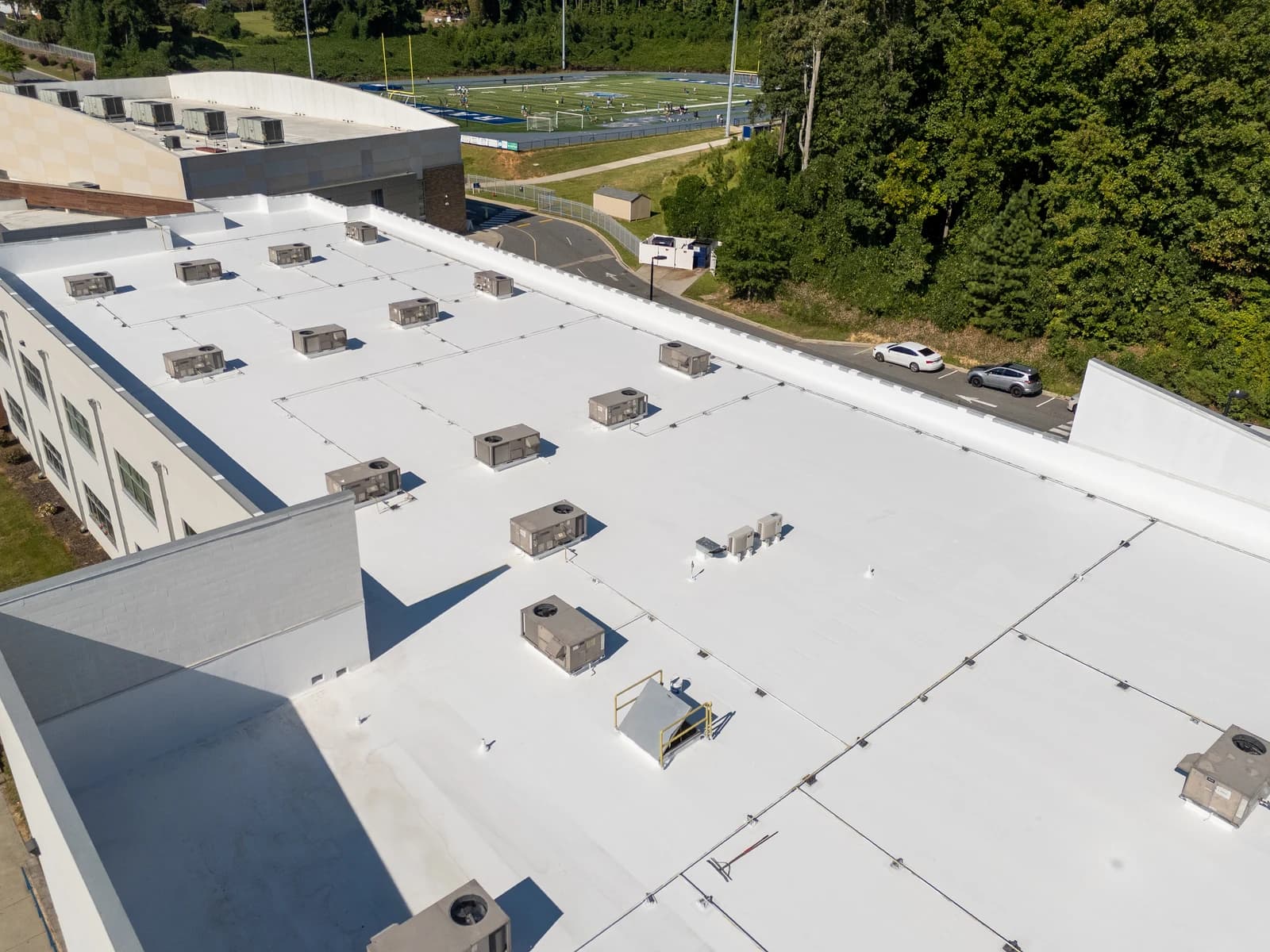 Mountain Island Charter School roof coating, aerial view 11 of completed multi-layer silicone system