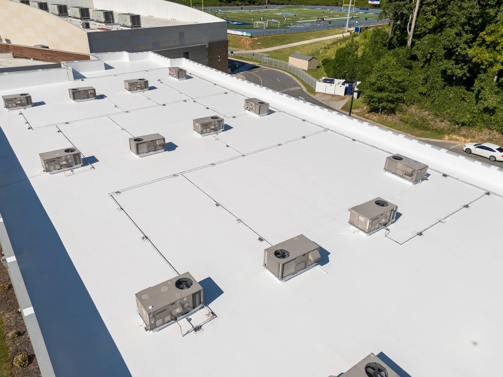 Mountain Island Charter School roof coating, aerial view 12 of completed multi-layer silicone system